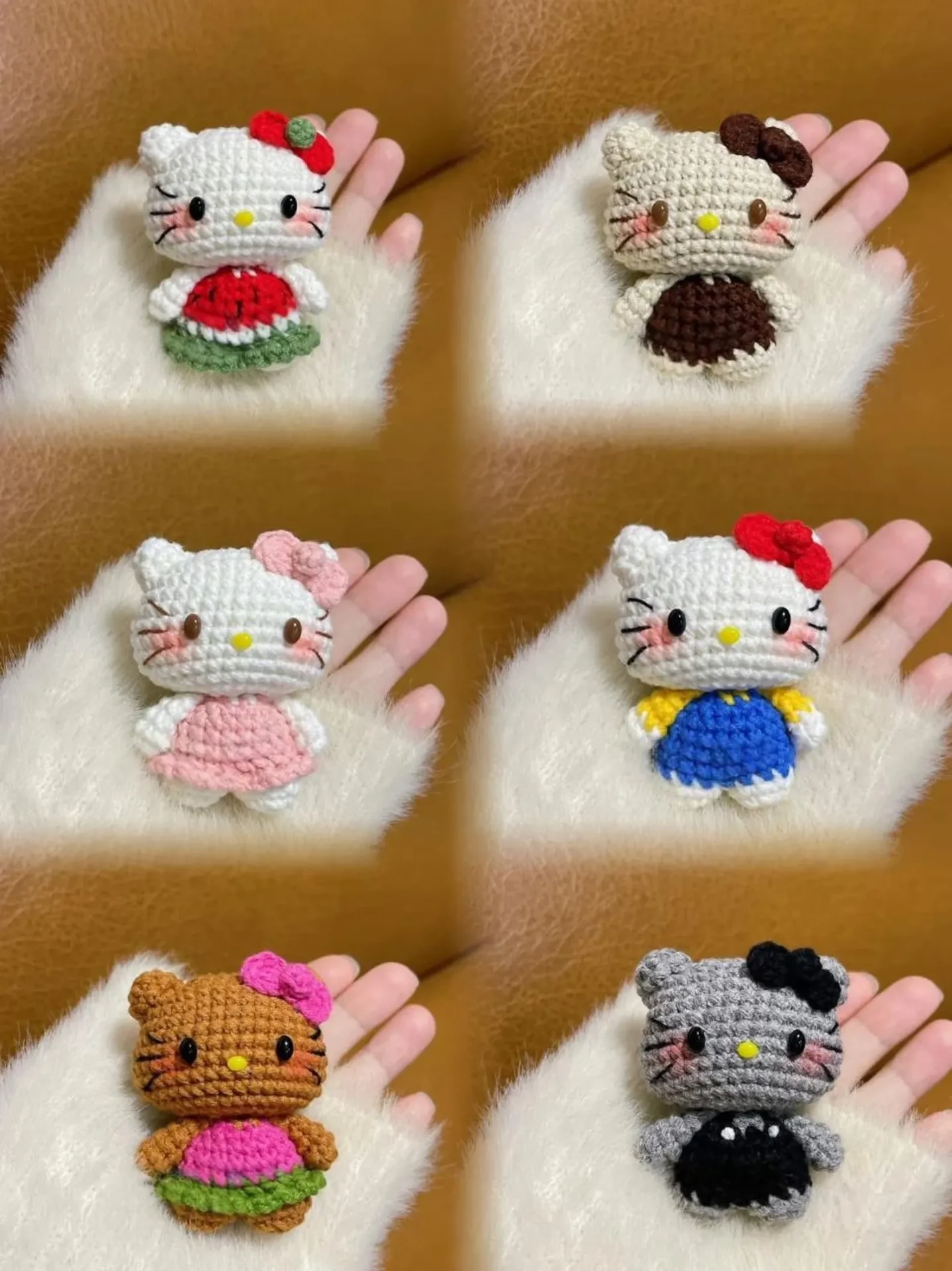 Crochet kitty keychains held in a hand